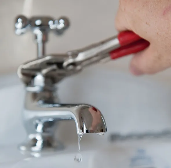 Experienced water leak repair plumbers inspecting a residential plumbing system for leaks.